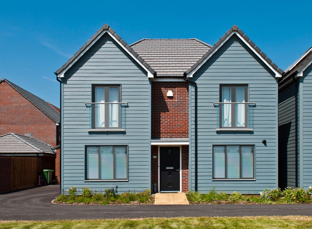 Flush Sash Windows on a New Build Home with a Light Blue / Grey Fascia